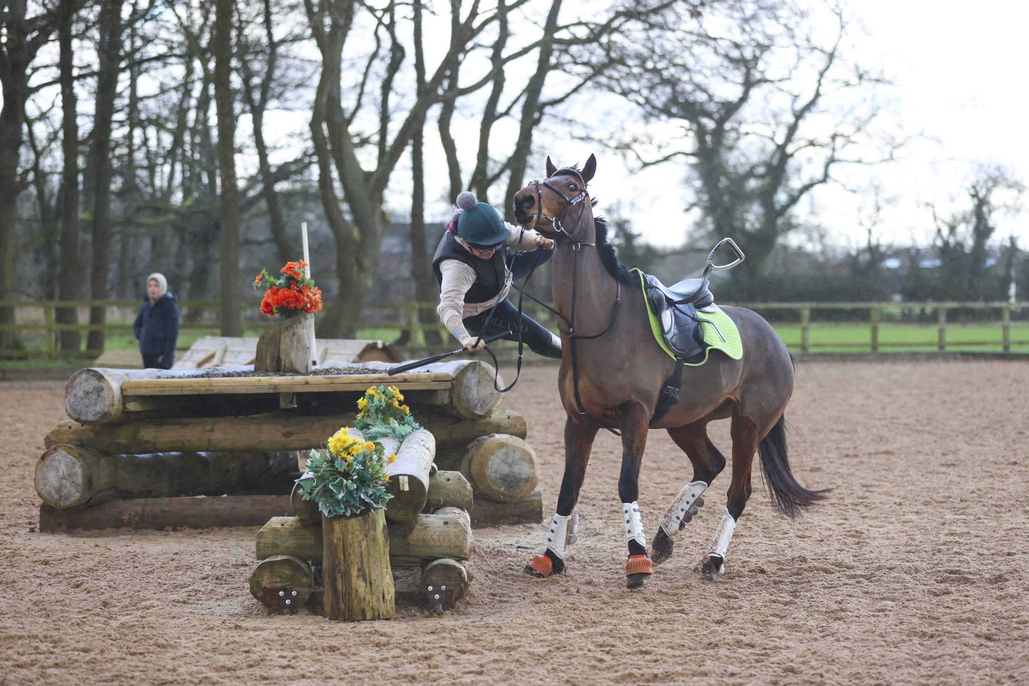Horse rider falling at a jump – example of a traumatic experience that can create a mental block.